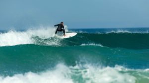 Fistral Beach, Newquay, Cornwall, UK, 09/16/2020. Surfer riding big wave
